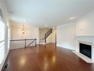 Unfurnished living room with dark wood-style floor