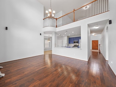 The heart of the home opens with dramatic ceilings