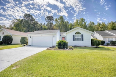 Single story home featuring driveway, a garage, an