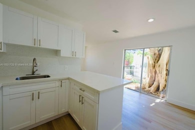 11316 Peachtree Dr unit 1, Miami, FL 33161 - photo 3