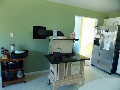Kitchen. with working wood cook stove