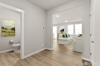 Main level powder room.  Photo is representational. Actual home is under construction and materials, colors, and finishes will vary. See site agent for details.