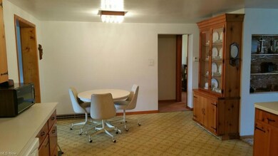 Third view of kitchen showing the dining area and 
