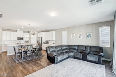 Living room featuring wood-type flooring