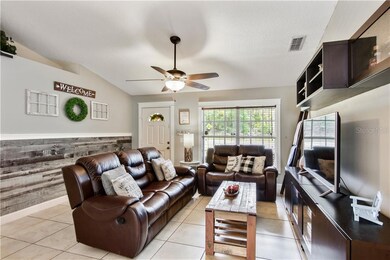 Great Room with wood siding, wood trim and built in entertainment center welcome you home
