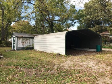 Car port and storage shed.
