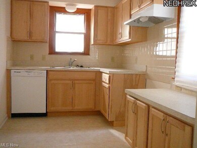 KITCHEN WITH NEWER FLOORING CABINETS AND DISHWASHE