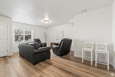 Living room & entry way featuring LVP - some people choose to finish this space into a 4th bedroom