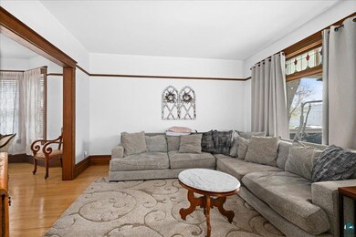 Living area with light wood-style floors and baseboards