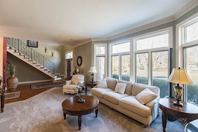 Sunlight cascades into the formal living room.