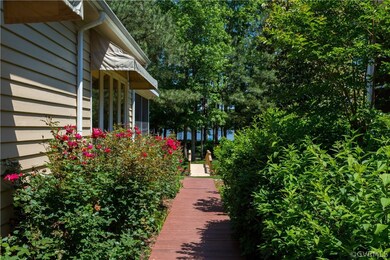 Side walkway from the kitchen deck leads to the ar