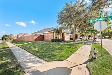 View of side of home with brick siding and a garage