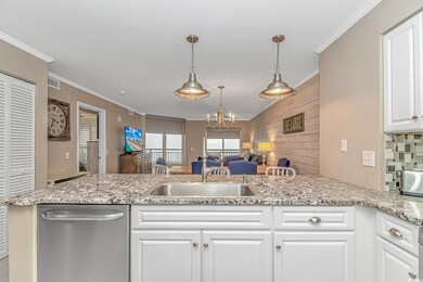 Kitchen featuring sink, crown molding, white cabin