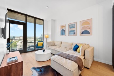 Living room featuring floor to ceiling windows an