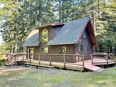 North side of the cabin.Nicely cared for decking, siding, composition shingle roof.