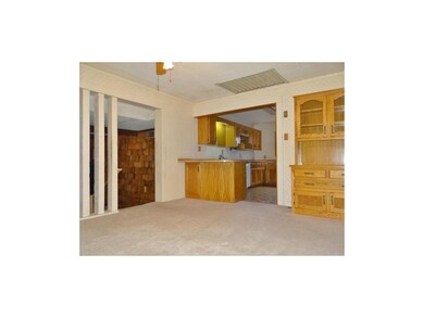 Second view from dining room into kitchen which of