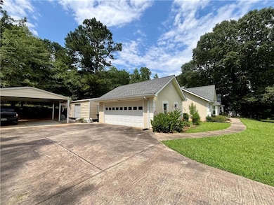 Detached 2-car garage plus additional 2-car detached cover