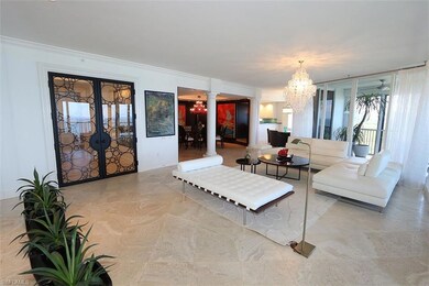 Living area featuring crown molding, french doors,