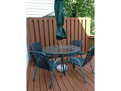 Exterior Back. Freshly painted deck and evening sh