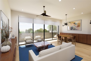 Living room with light wood finished floors, recessed lighting, a ceiling fan, and wainscoting