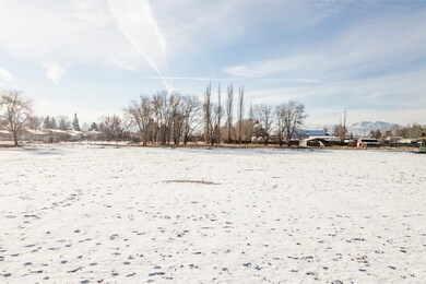 Snowy yard with a mountain view