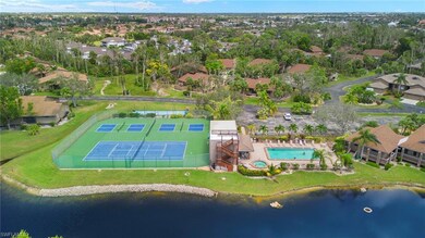 Drone / aerial view of amenities with a water view