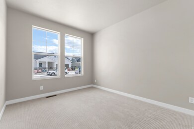 Carpeted empty room with baseboards