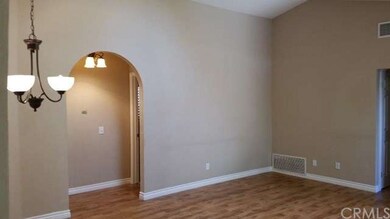 open and bright with sky light and decorative arched entry