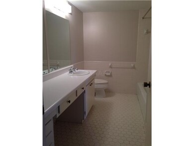 Spacious bath off of living room, for guests. Neut