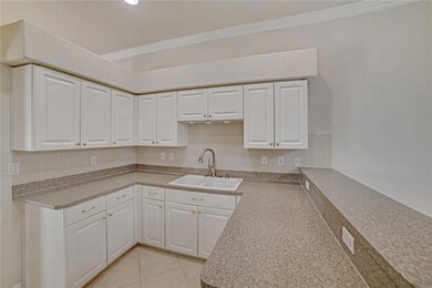 KITHCEN WITH OVERHEAD LIGHTING, NEWER SS APPLIANCES  AND BREAKFAST BAR