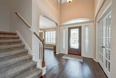 Beautiful entry way with glass etched front door.