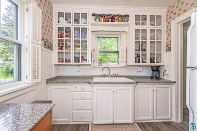 Kitchen featuring sink, hardwood / wood-style floo