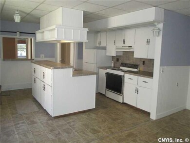 Kitchen. THE KITCHEN IS SPARKLING WHITE AND SPACIO