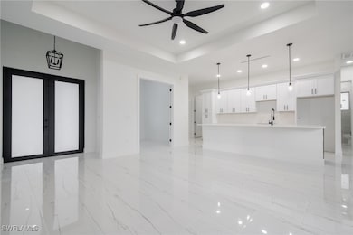 Unfurnished living room with a ceiling fan, recess