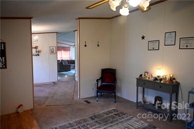 Front Living Room, looking through Dining Room, towards Kitchen and Den