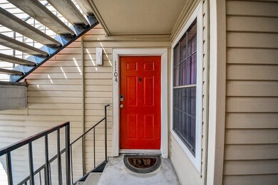 This is a welcoming entryway with a vibrant red do