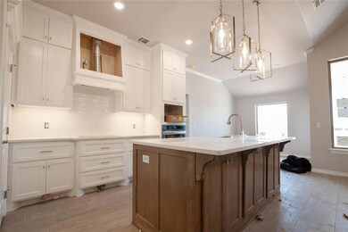 Kitchen featuring light hardwood / wood-style floo