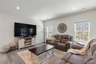 Living room with light wood-type flooring