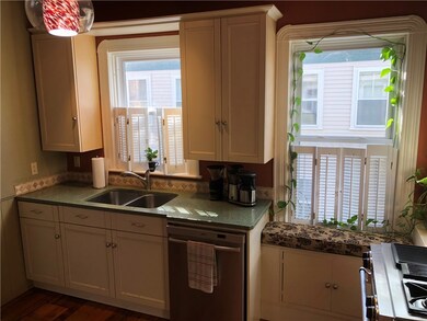 Beautiful cabinetry and counter tops with a window
