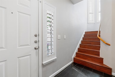 Entrance foyer featuring baseboards, plenty of na