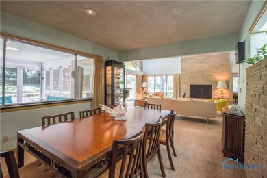 Dining room is adjacent to family room and kitchen