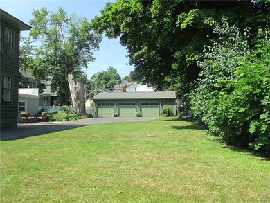Nice side yard is tastefully landscaped offering p