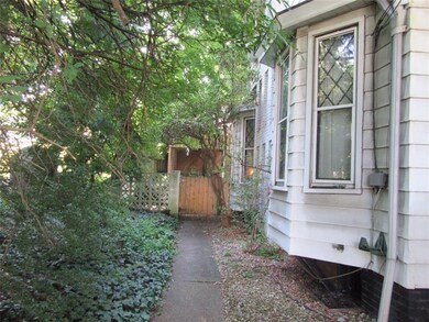 Charming walkway leading to back yard.