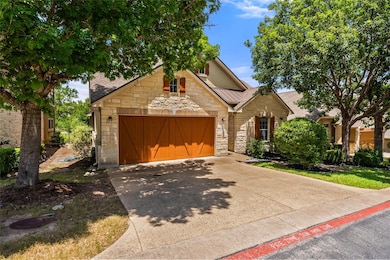 View of front of house featuring stone siding, dr
