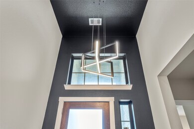 Custom updated lighting welcomes you in the entryw