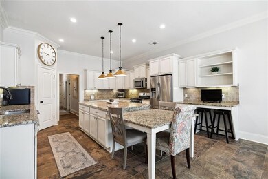 MASSIVE GRANITE ISLAND AND COOL DROP DOWN LIGHTS