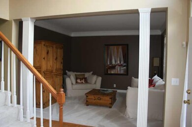 Straight out of Pottery Barn decor....Formal living room complete with plush cream colored carpet
