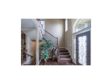Simulated Photo. Entry w/ hand scraped wood floors