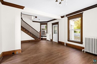 Interior space featuring dark wood-type flooring, 