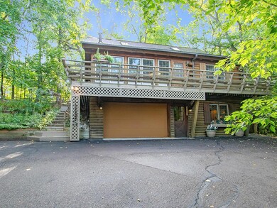 Wrap around porch & two stall garage with plenty o